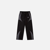 Front view of the black Vintage Black Patchwork Pants in a gray background