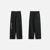Front & Back view of the black Y2k Vintage Baggy Jeans in a gray background