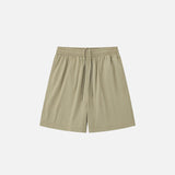 Front view of the khaki Loose Solid Color Sports Shorts in a gray background 