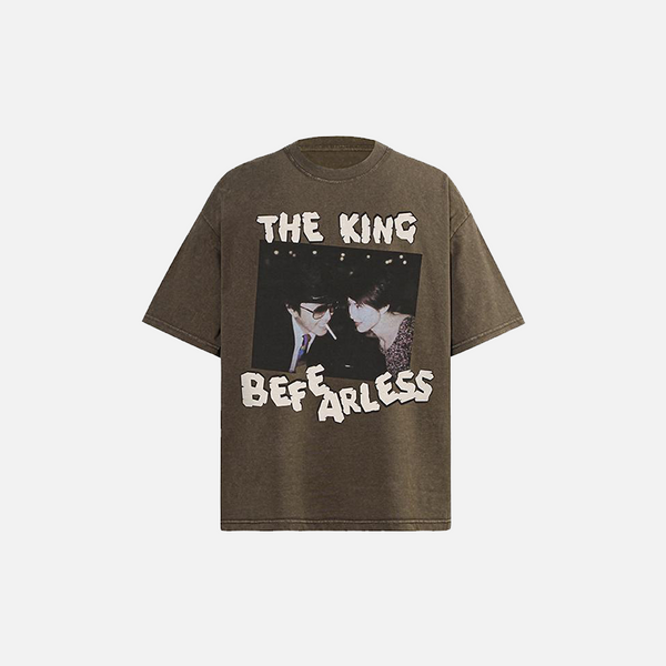 Front view of the brown The King Be Fearless Graphic T-shirt in a gray background