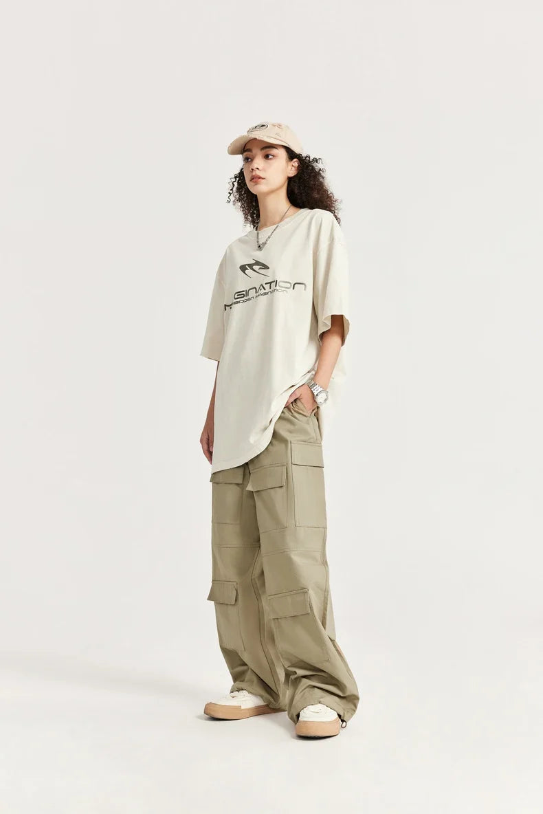 Model wearing the khaki Trailblazer Baggy Cargo Pants in a gray background