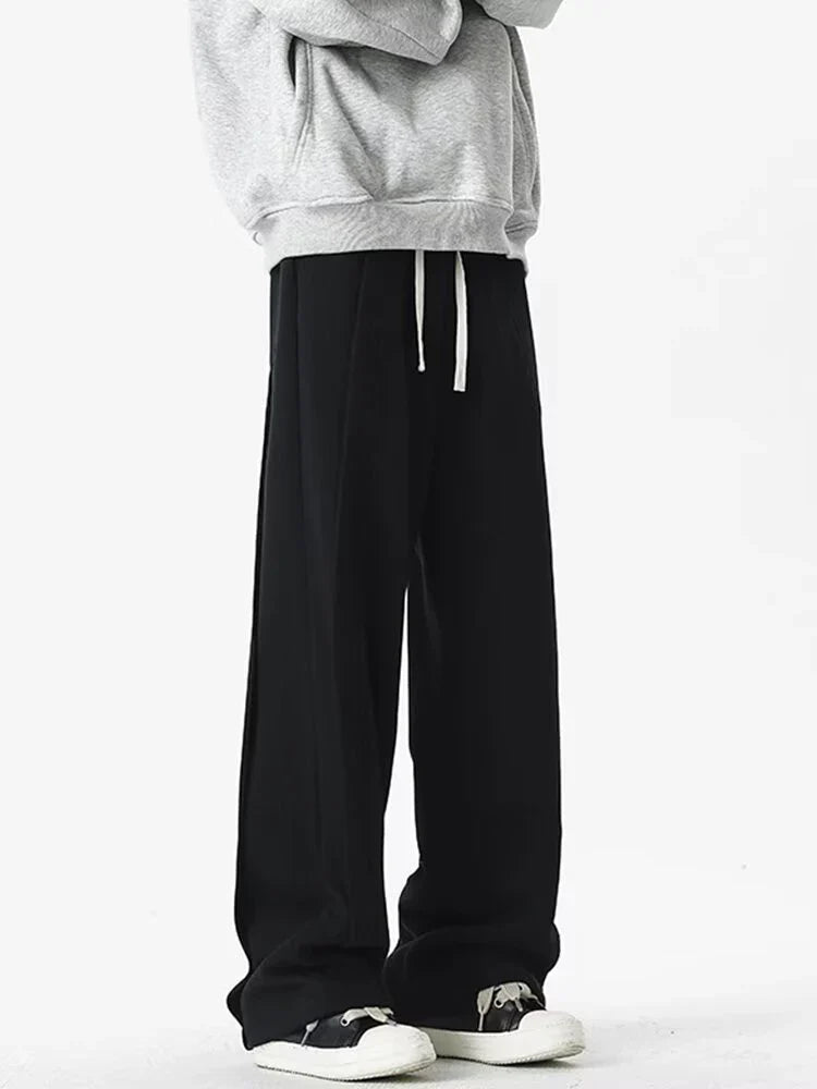 Front view of the black Loose Fit Pleated Sweatpants