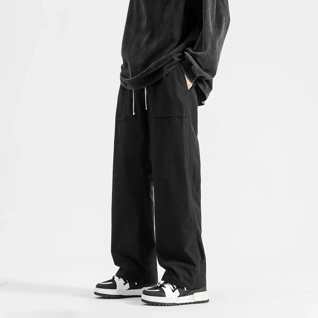 Model wearing the black Wide-Leg Drawstring Cargo Pants