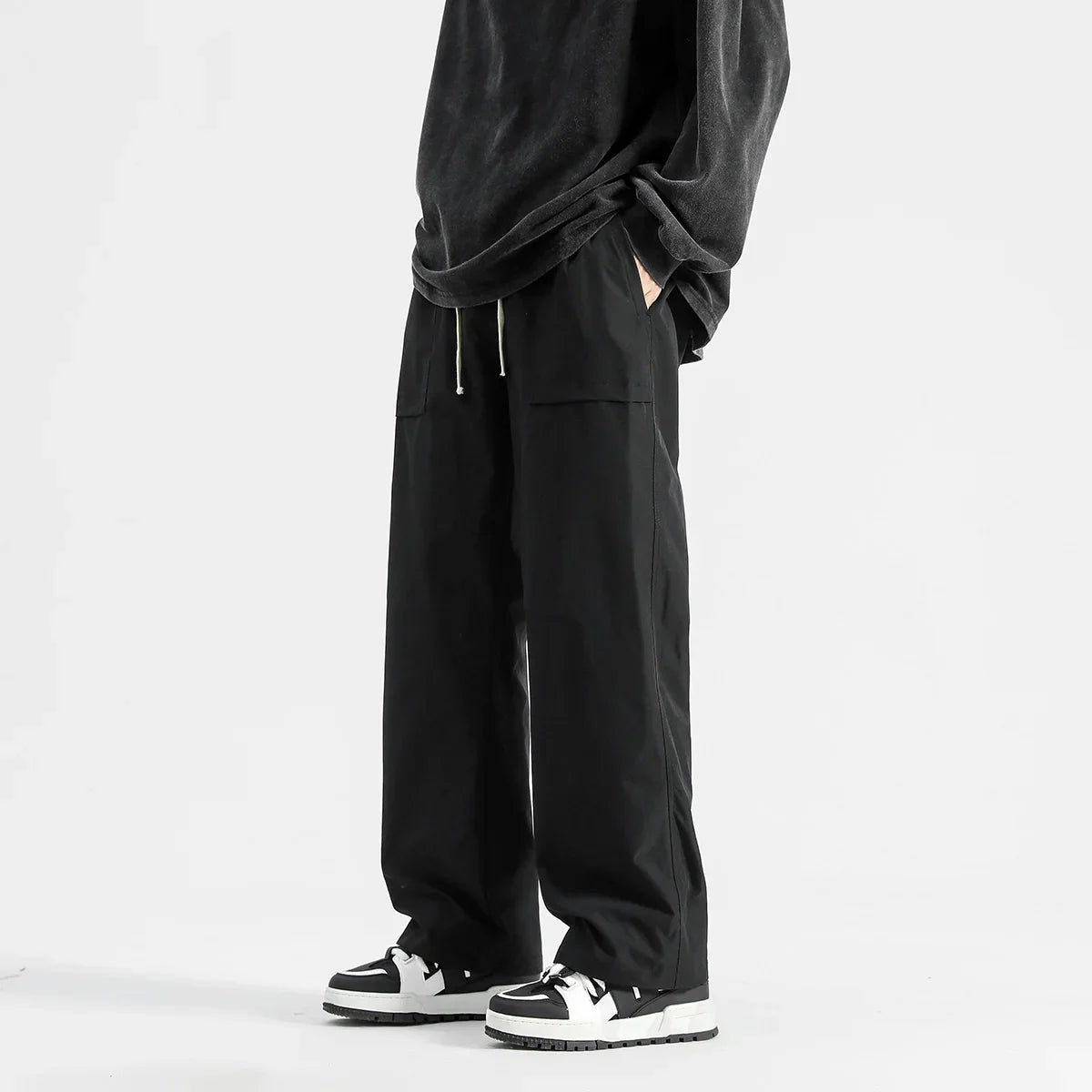 Model wearing the black Wide-Leg Drawstring Cargo Pants