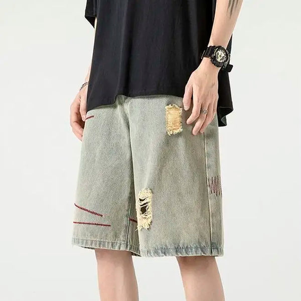 Stylish Spliced Button Zipper Ripped Shorts