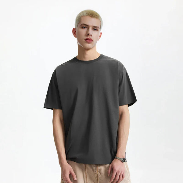 Model wearing the dark gray Y2K Essential T-Shirt