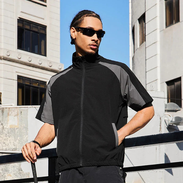 Model wearing the black Utility Short-Sleeve Jacket